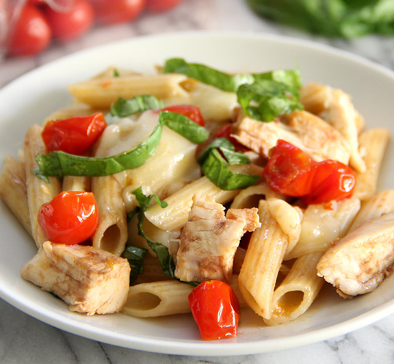 This yummy Chicken Caprese Pasta recipe is filled with fresh and ripe tomatoes, basil, mozzarella cheese, and balsamic vinegar.  #STARFineFoods