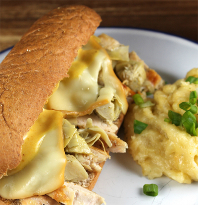 Warm your heart with this Garlic Chicken & Artichoke Sub Sandwich recipe! With gooey melted cheese over shredded chicken and all inside a toasted bun! #STARFineFoods