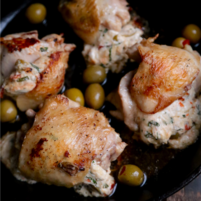 Get a little spicy with these one pan Hot Pepper Olive Stuffed Chicken Thighs. Perfect for a weeknight dinner, or elegant enough for a date night in! #STARFineFoods