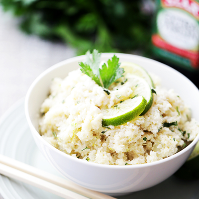 A delicious recipe for cauliflower rice cooked in coconut milk and loaded with fresh lime juice and lime zest! This is the ideal healthy side dish to any meal! #STARFineFoods