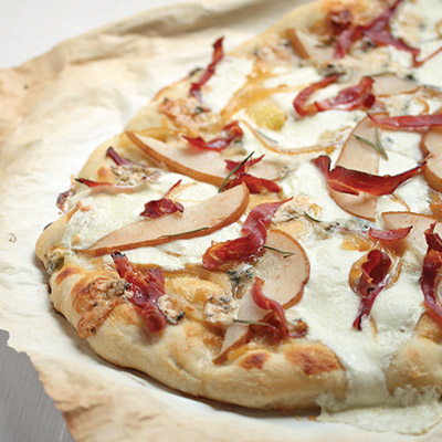 Try this Proscuitto and Pear Pizza with honey dijon sauce, caramelized onion and a rosemary olive oil pizza dough recipe. Crispy and packed with flavor.  #STARFineFoods
