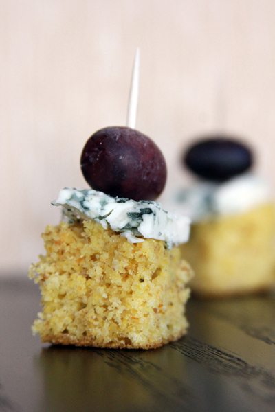 Try this perfect and easy Olive Oil Cornbread bites appetizer recipe for your next holiday gathering! Paired with blue cheese and kalamata olives to create the essence of a cheese plate in a single bite. #STARFineFoods