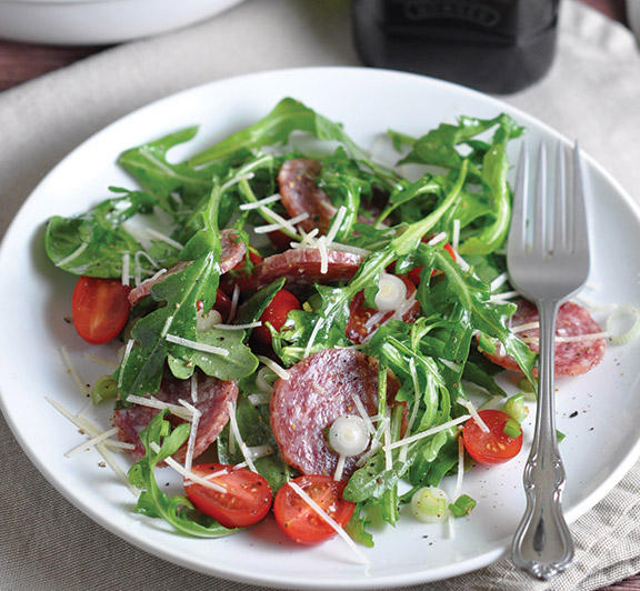 This salami salad recipe comes together in 15 minutes, with baby greens, sweet cherry tomatoes, Parmesan, and a light dressing. #STARFineFoods